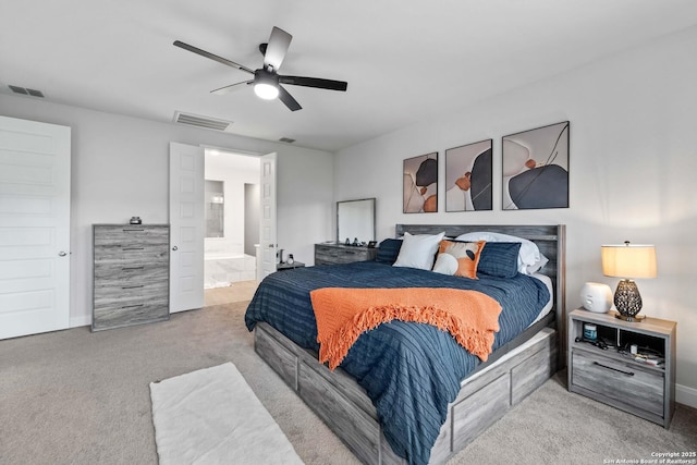 carpeted bedroom featuring ceiling fan and ensuite bathroom