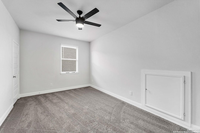 spare room featuring carpet floors and ceiling fan