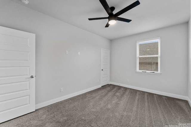 carpeted empty room featuring ceiling fan