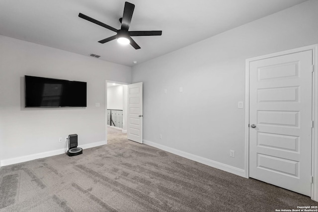 unfurnished living room with carpet floors and ceiling fan