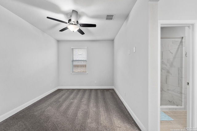 spare room with ceiling fan and carpet floors