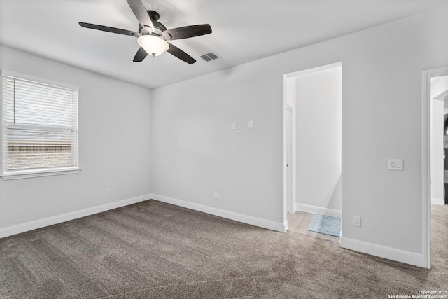 carpeted empty room with ceiling fan