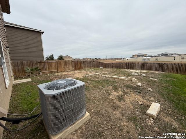 view of yard with central AC