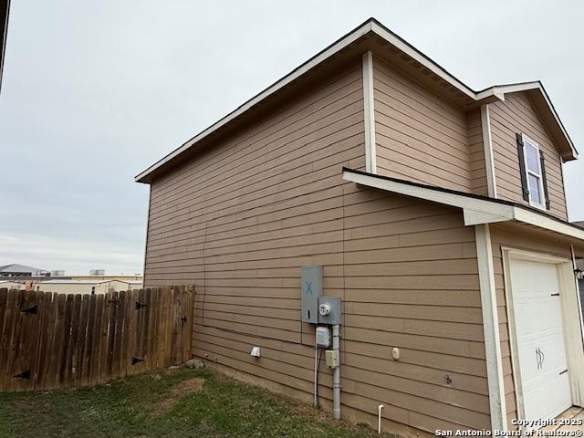 view of side of property with a garage