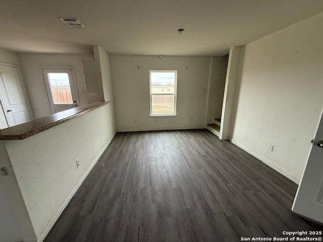 spare room with dark hardwood / wood-style flooring