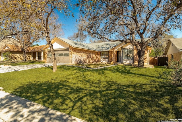 single story home featuring a garage and a front lawn