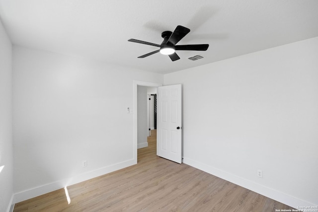 unfurnished room with ceiling fan and light hardwood / wood-style flooring