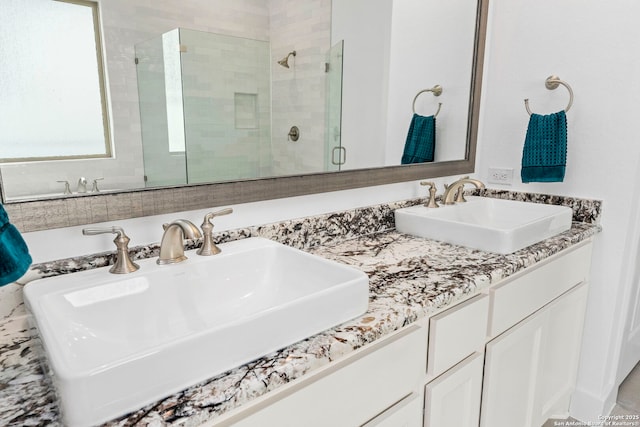 bathroom with an enclosed shower and vanity