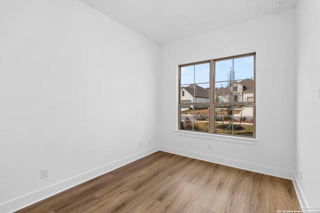 unfurnished room featuring wood-type flooring