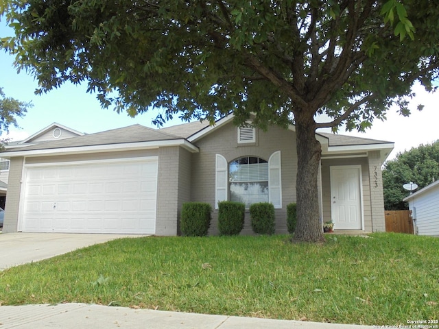 ranch-style house with a garage and a front yard