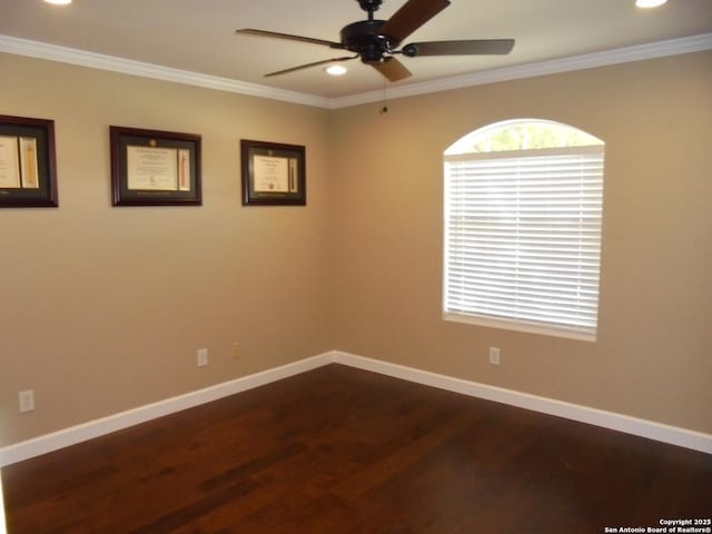 spare room featuring ceiling fan, ornamental molding, and dark hardwood / wood-style floors