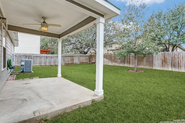 view of yard featuring ceiling fan, a patio area, and central air condition unit