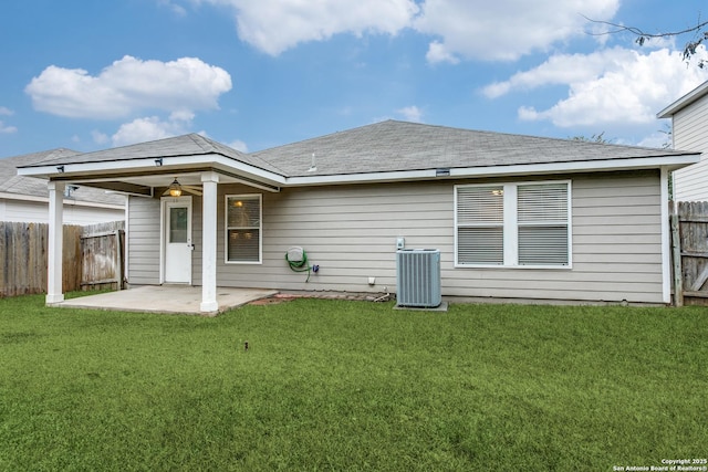 back of house with central AC unit, a yard, a patio area, and ceiling fan