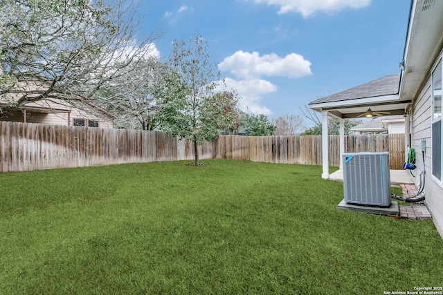 view of yard with cooling unit and ceiling fan