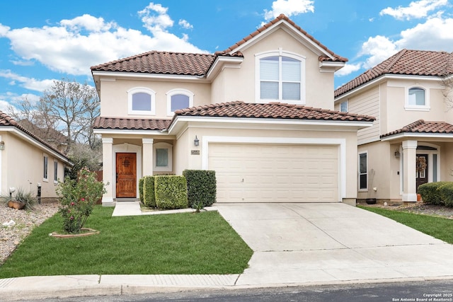 mediterranean / spanish-style house with a garage and a front lawn