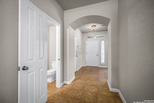 entryway with tile patterned floors