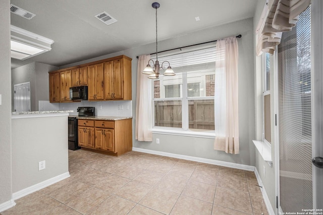 kitchen featuring backsplash, a notable chandelier, black appliances, hanging light fixtures, and light tile patterned floors