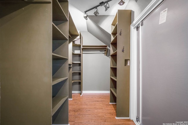 walk in closet featuring light hardwood / wood-style floors