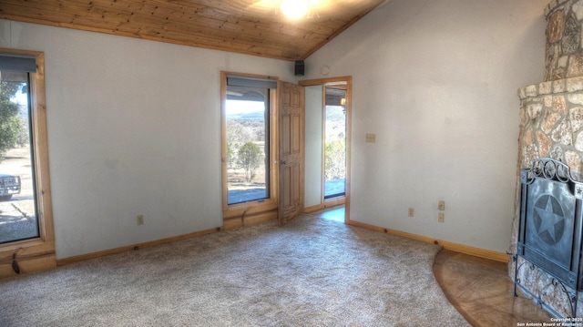 unfurnished living room featuring vaulted ceiling, wooden ceiling, and carpet flooring