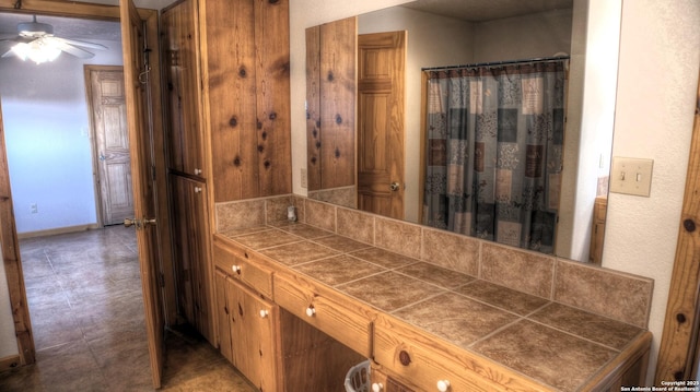 bathroom featuring ceiling fan and vanity