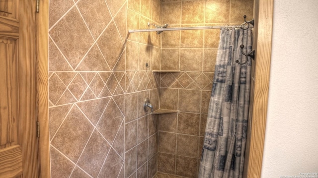 bathroom featuring curtained shower