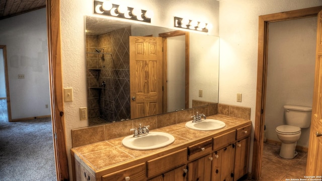 bathroom with toilet and vanity