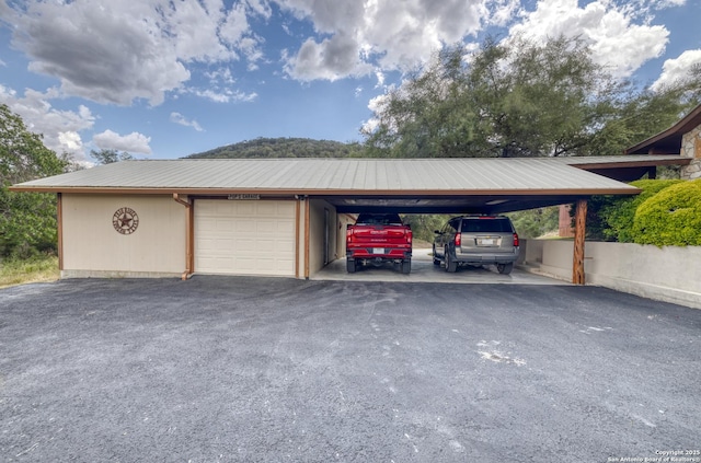 garage with a carport