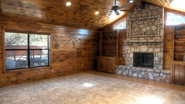 unfurnished living room featuring wooden ceiling, wood walls, vaulted ceiling with beams, and carpet floors