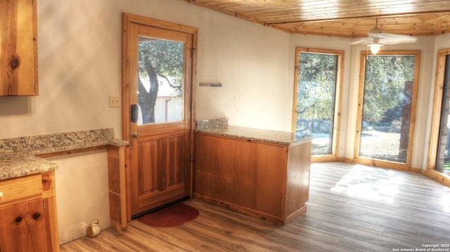 entryway with ceiling fan, light hardwood / wood-style flooring, and wooden ceiling