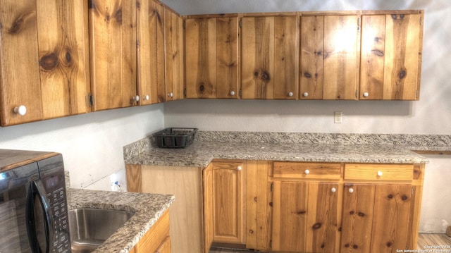 kitchen with light stone countertops