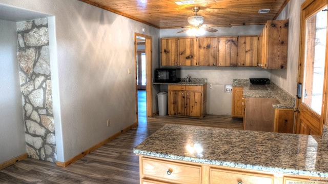 kitchen with wood ceiling, ceiling fan, dark hardwood / wood-style flooring, light stone countertops, and crown molding