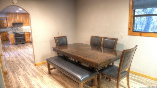 dining space with light hardwood / wood-style floors