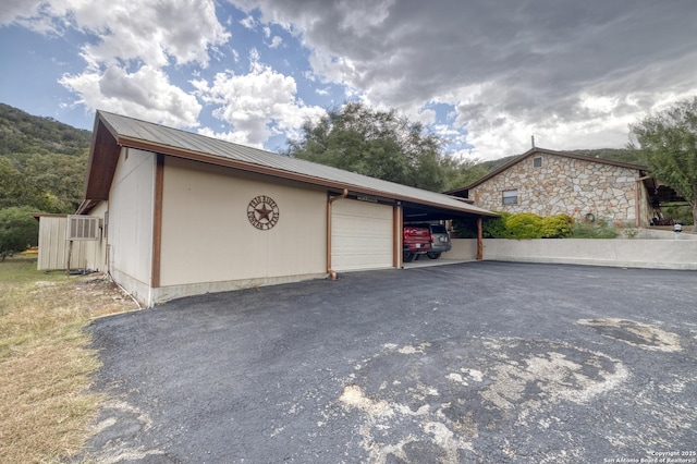 view of side of property featuring a garage