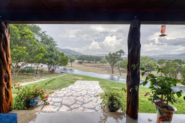 view of patio / terrace featuring a mountain view