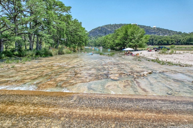 view of mountain feature featuring a water view