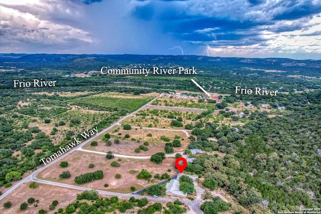 birds eye view of property featuring a mountain view