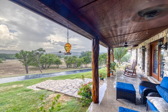 view of patio / terrace featuring ceiling fan