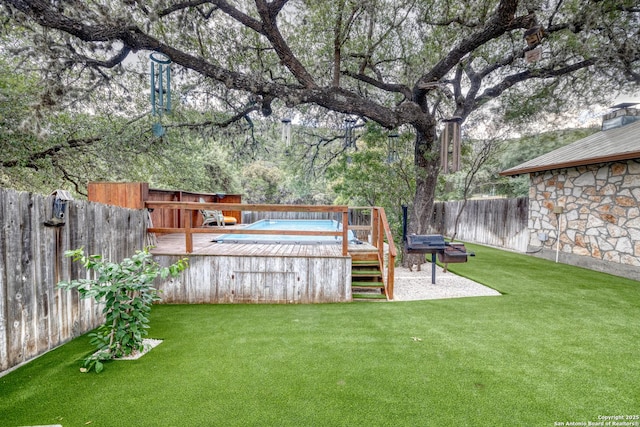 view of yard featuring a wooden deck