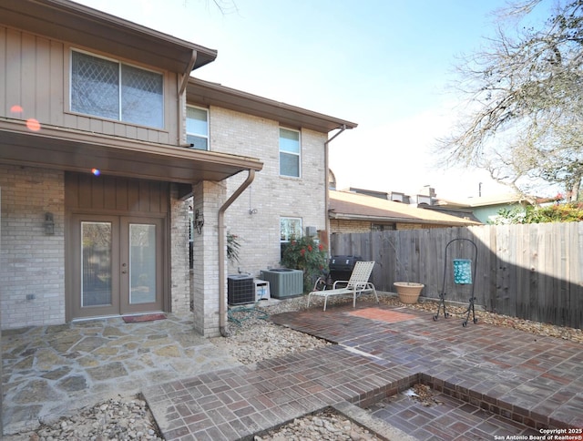 view of patio featuring central AC and french doors