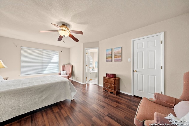 bedroom with ceiling fan, a textured ceiling, dark hardwood / wood-style flooring, and ensuite bath