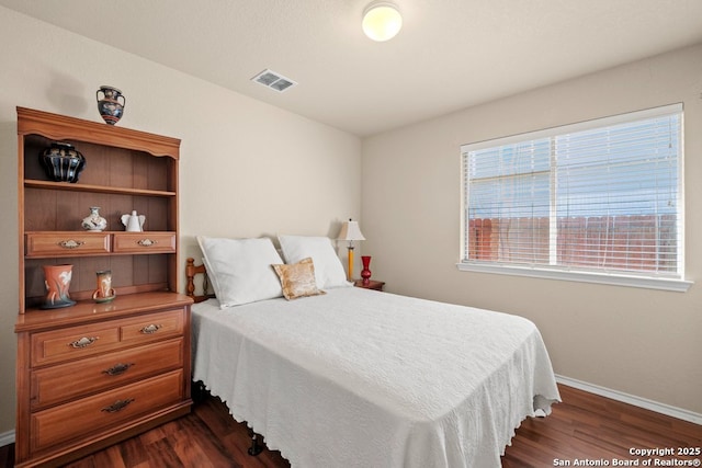 bedroom featuring dark hardwood / wood-style floors