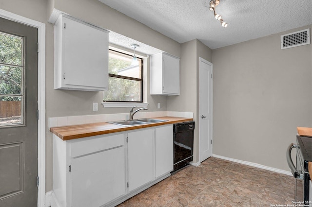 kitchen featuring sink, white cabinets, black dishwasher, and a textured ceiling