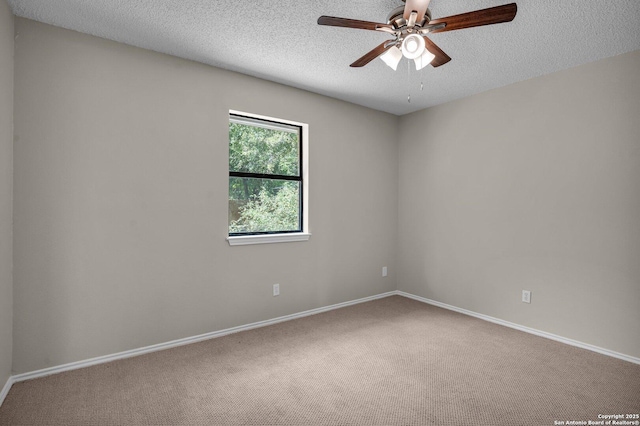 unfurnished room with carpet, ceiling fan, and a textured ceiling