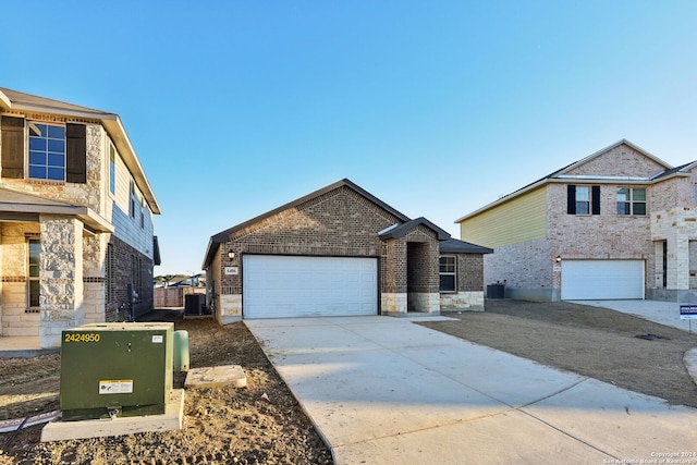 front facade with a garage and cooling unit