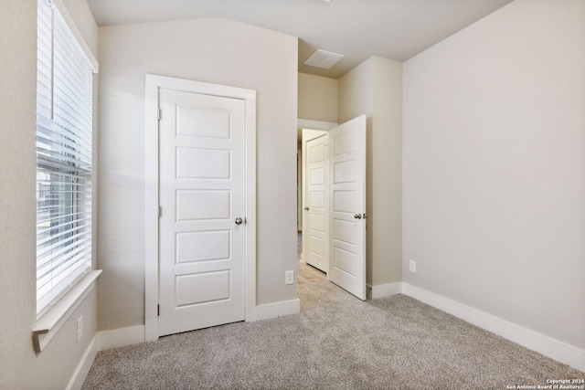 unfurnished bedroom with light carpet