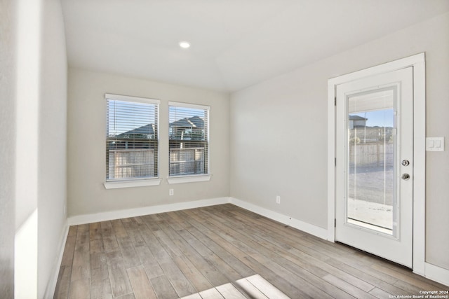 spare room featuring light hardwood / wood-style floors