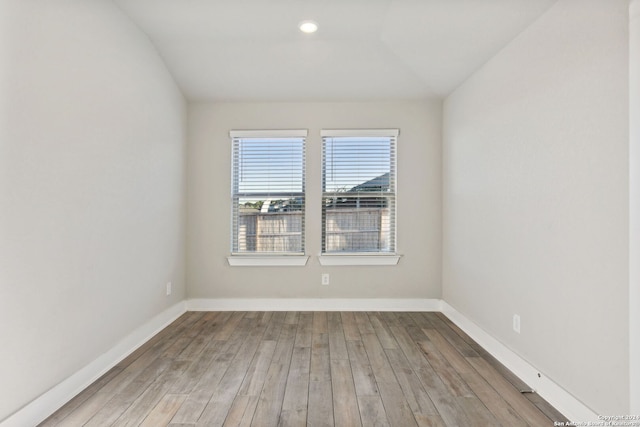 spare room with light hardwood / wood-style floors