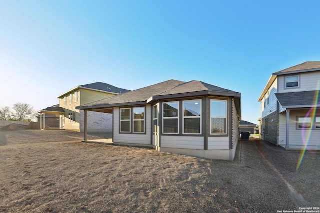 back of property with central air condition unit