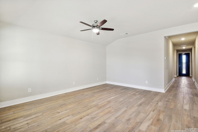 empty room featuring ceiling fan and light hardwood / wood-style floors