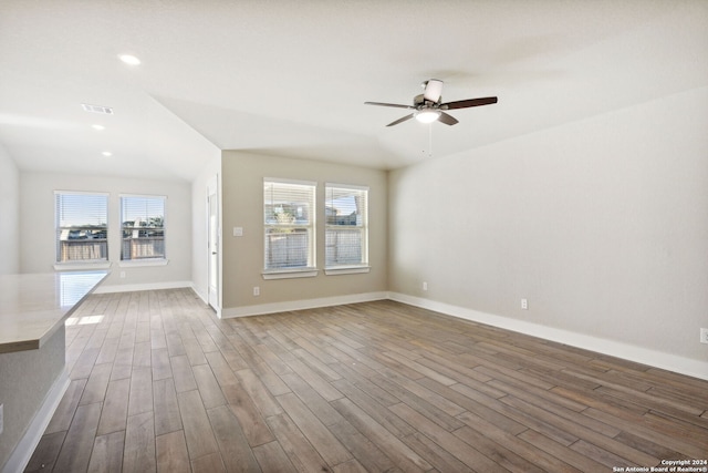 spare room with ceiling fan and wood-type flooring